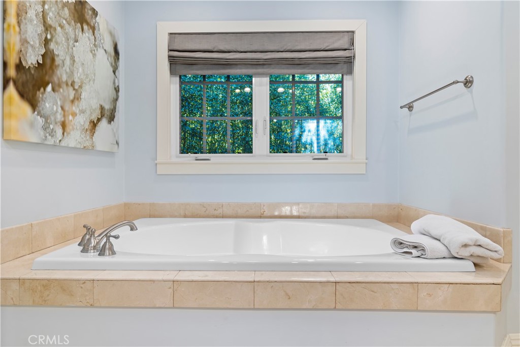 5215 Middlecrest Road Rancho Palos Verdes, CA 90275 - Photo 17 of 53 a bathroom with a bathtub and a window