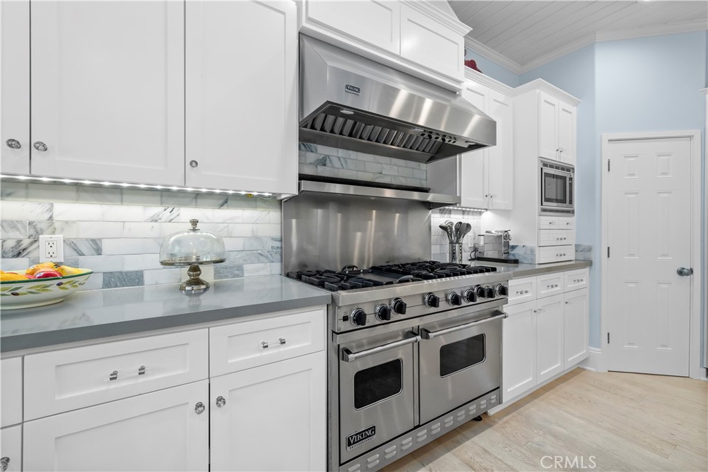 5215 Middlecrest Road Rancho Palos Verdes, CA 90275 - Photo 24 of 53 a kitchen with white cabinets and appliances