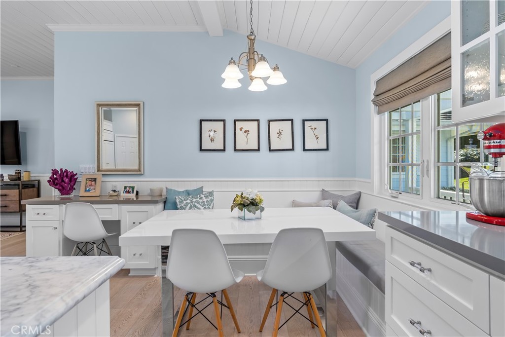 5215 Middlecrest Road Rancho Palos Verdes, CA 90275 - Photo 25 of 53 a kitchen with a dining table chairs stove and cabinets