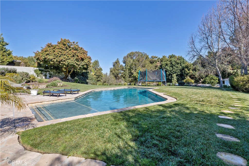 5215 Middlecrest Road Rancho Palos Verdes, CA 90275 - Photo 40 of 53 a view of a swimming pool with a yard