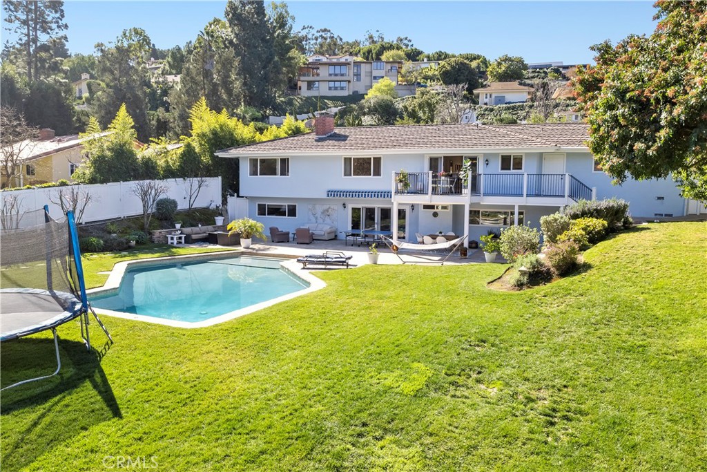 5215 Middlecrest Road Rancho Palos Verdes, CA 90275 - Photo 51 of 53 a view of a swimming pool with a lounge chairs