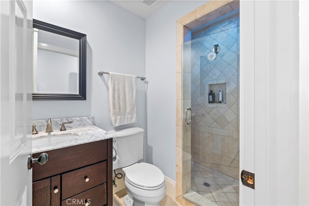 5215 Middlecrest Road Rancho Palos Verdes, CA 90275 - Photo 7 of 53 a bathroom with a sink a toilet a mirror and shower