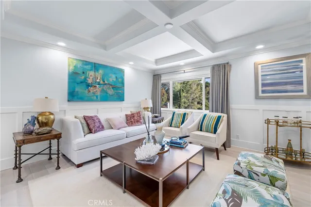 a living room with furniture and next to a window