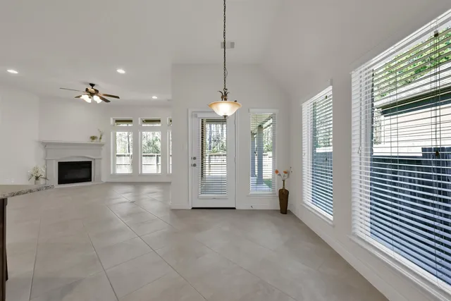 a view of a kitchen with a sink and a fireplace