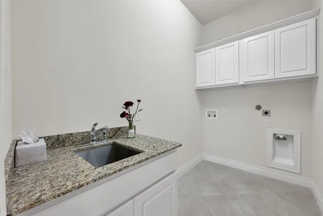 a bathroom with a sink and cabinets