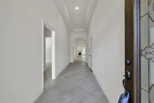 a view of a hallway with a white walls