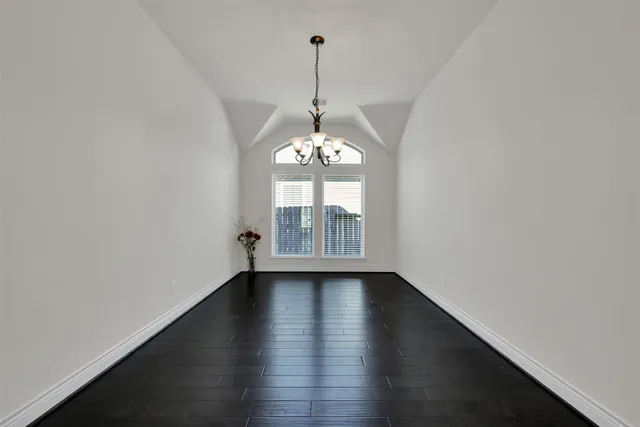 a view of a room window and wooden floor
