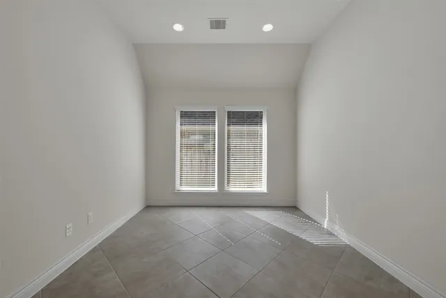 an empty room with windows