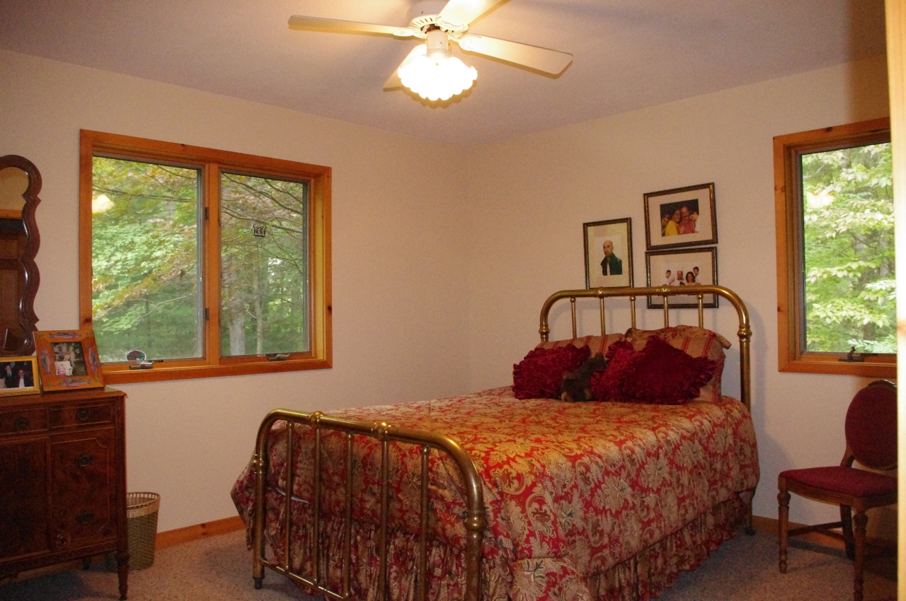 106 Stevens Lake Road Monterey, MA 01245 - Photo 11 of 16 a bedroom with a bed and window
