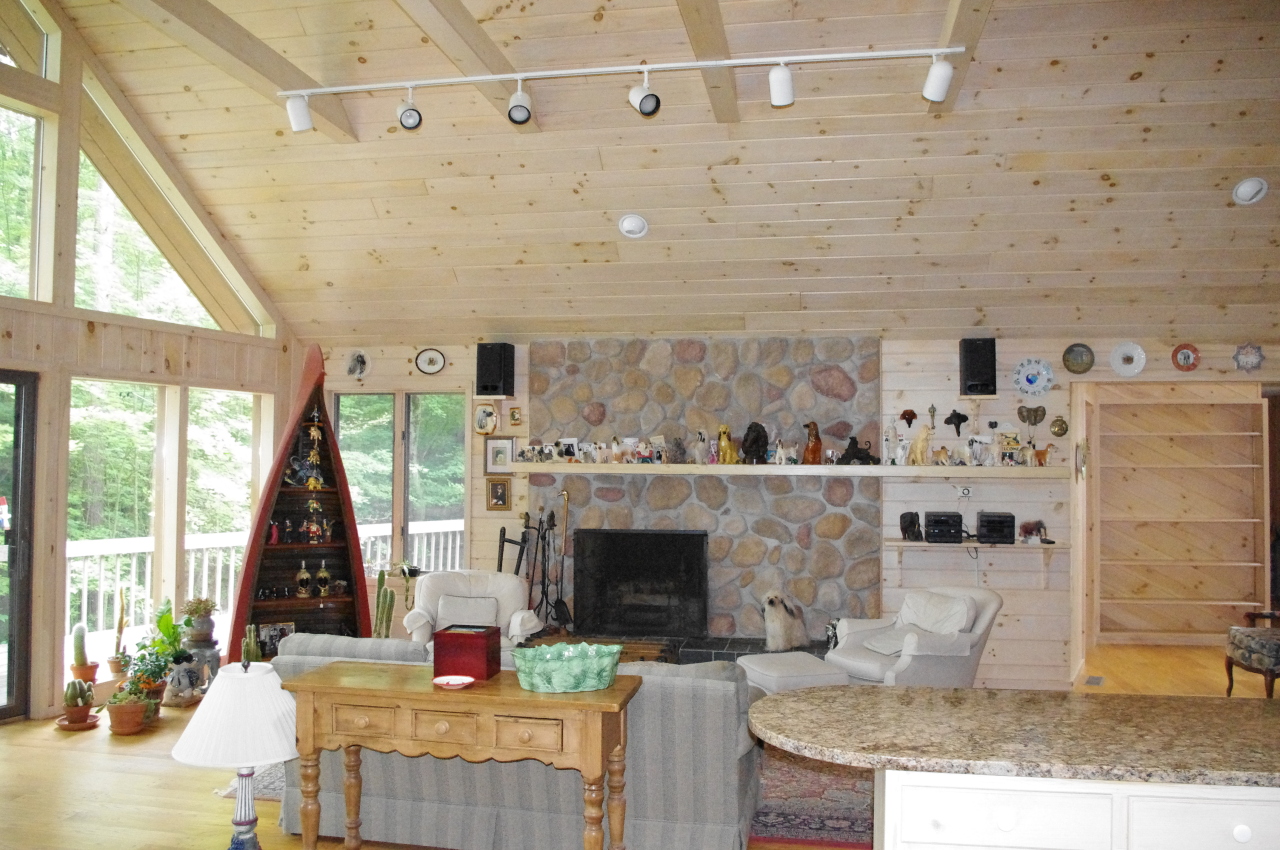106 Stevens Lake Road Monterey, MA 01245 - Photo 9 of 16 a living room with fireplace furniture and a fireplace