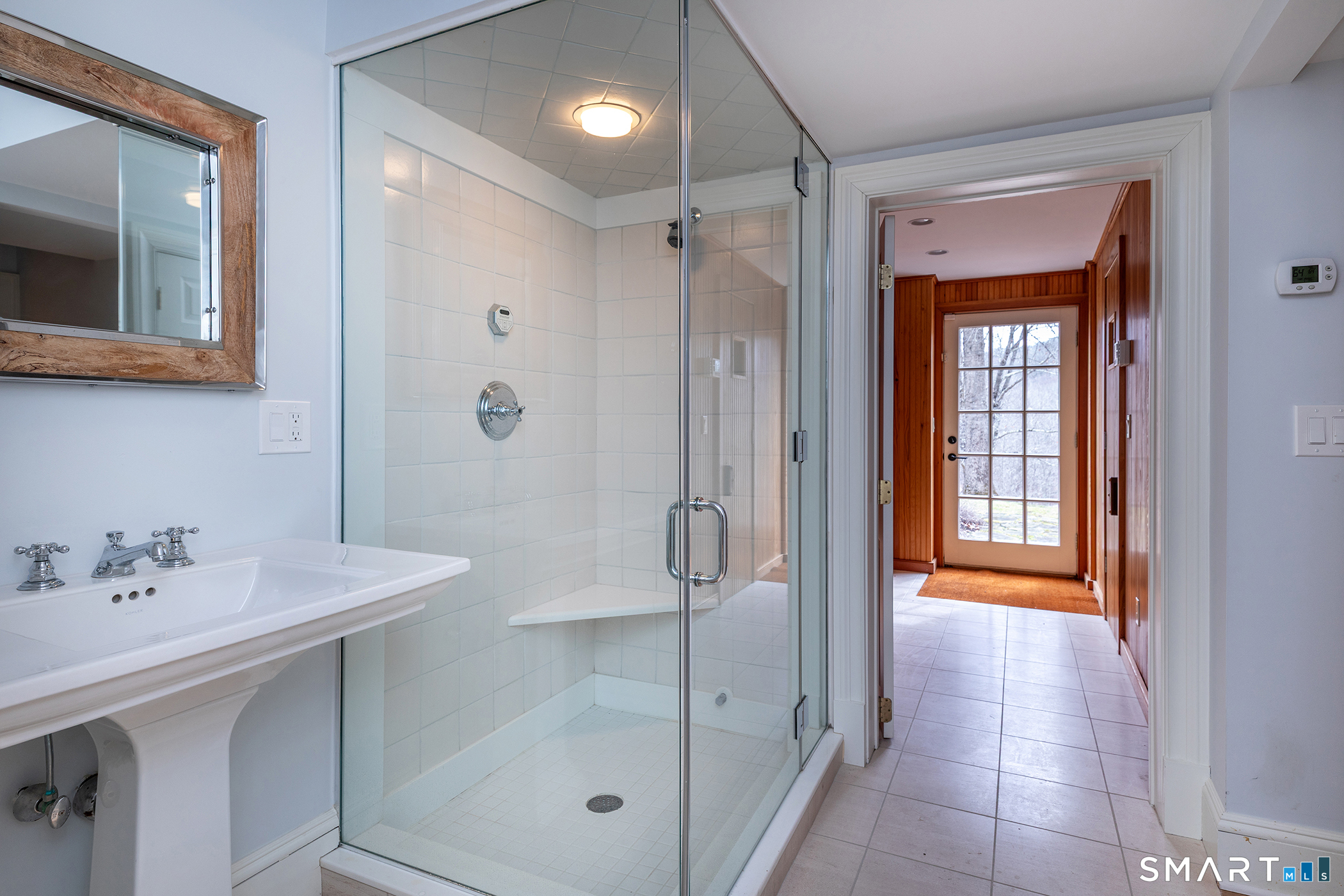 47 Squire Road Roxbury, CT 06783 - Photo 16 of 27 a bathroom with a shower sink and mirror