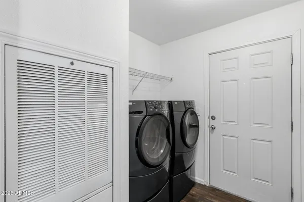 a bathroom with a granite countertop sink toilet a mirror and shower