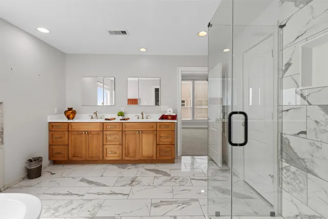 a room with a washing machine and mirrors