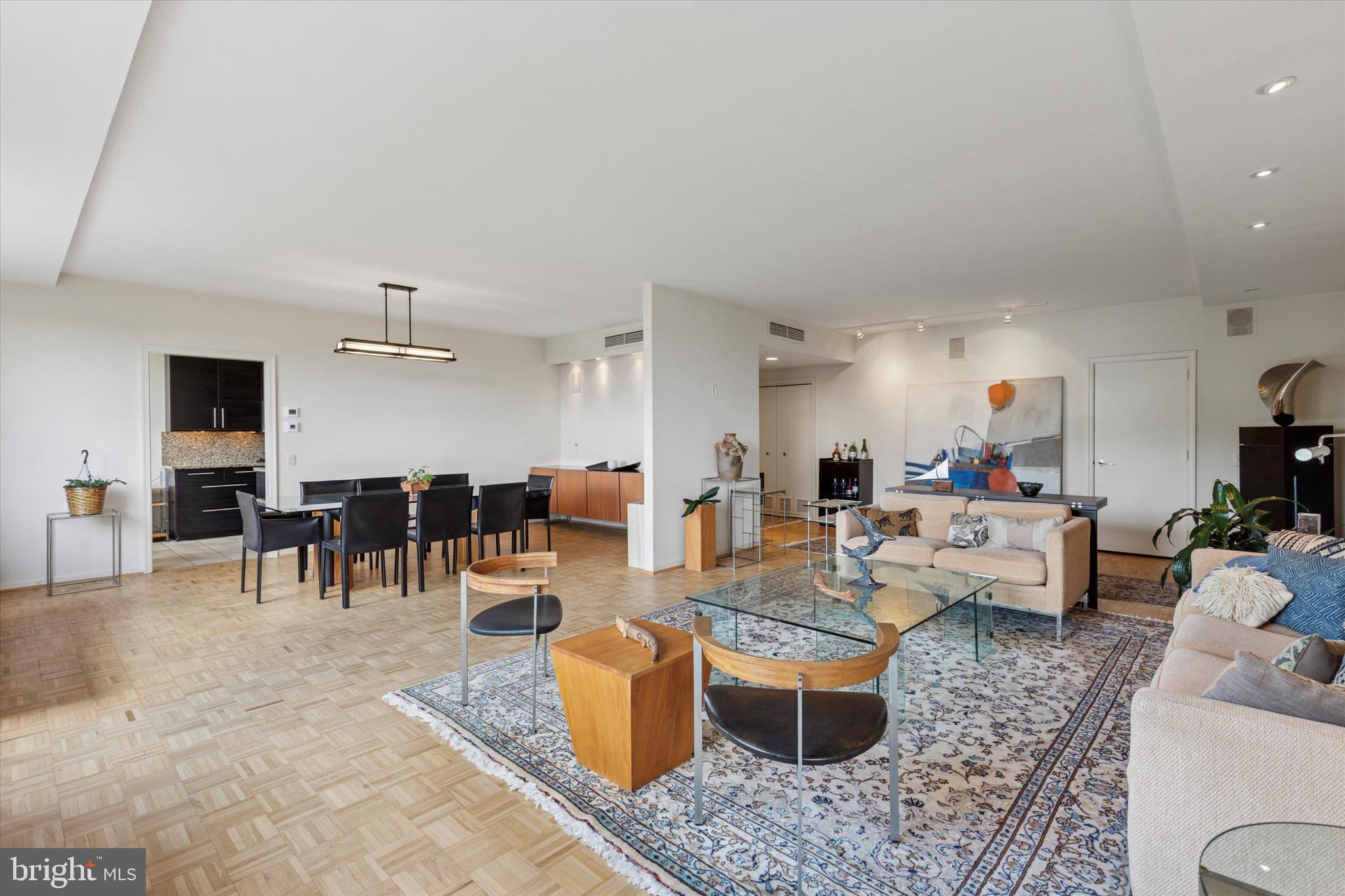 191 Presidential Boulevard, Unit R605 Bala Cynwyd, PA 19004 - Photo 12 of 35 a living room with lots of furniture and kitchen view