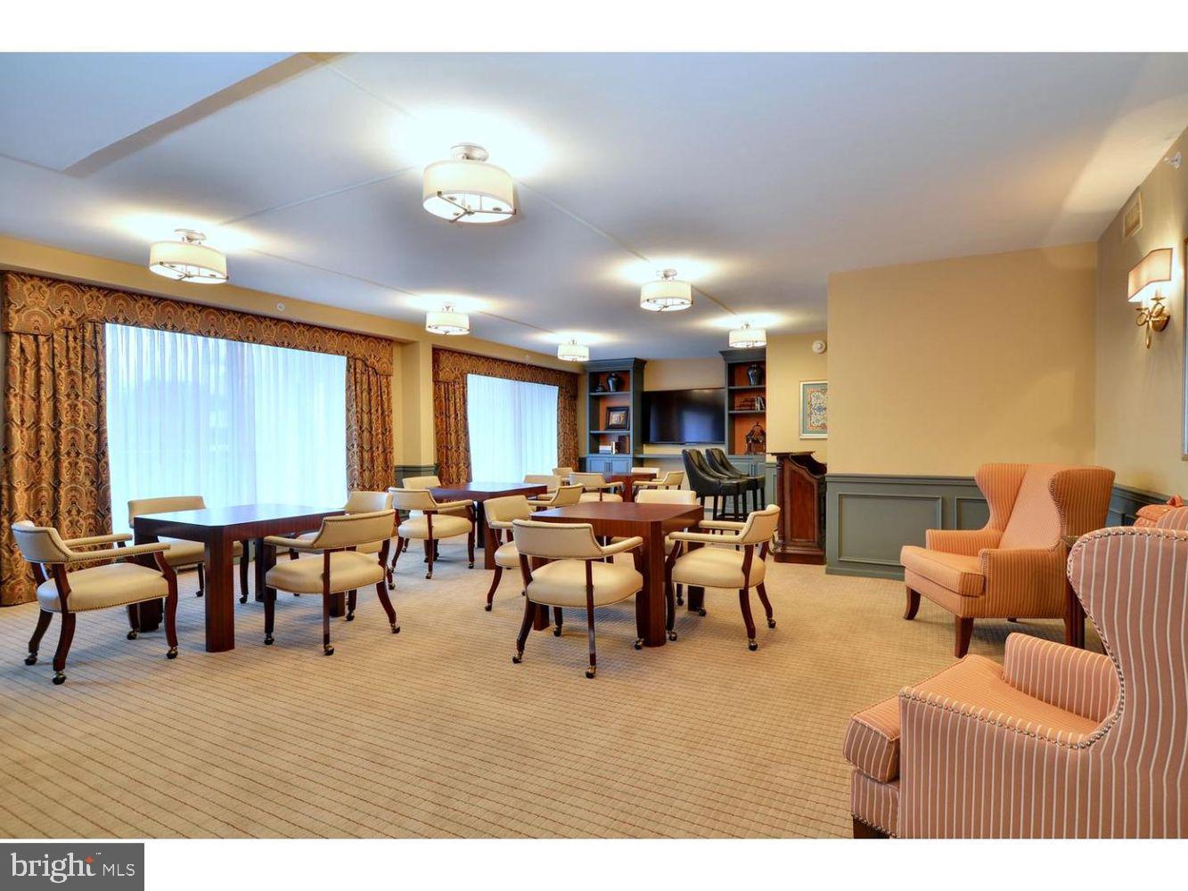 191 Presidential Boulevard, Unit R605 Bala Cynwyd, PA 19004 - Photo 31 of 35 a view of a dining room with furniture and a chandelier