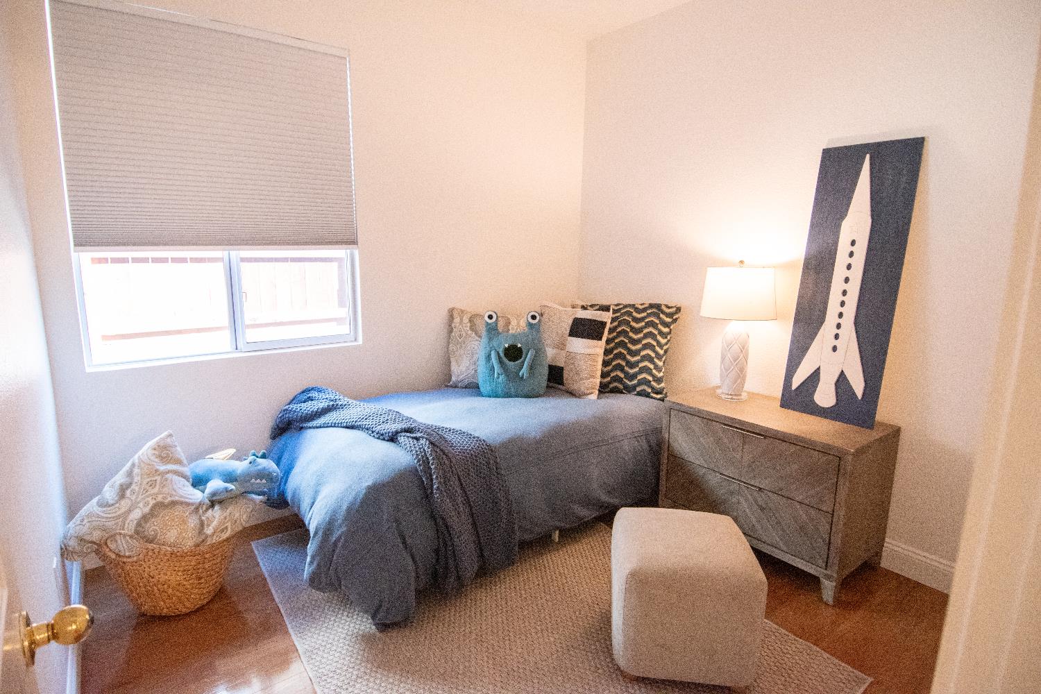 105 Whiting Way Folsom, CA 95630 - Photo 35 of 78 a bedroom with a bed and wooden floor