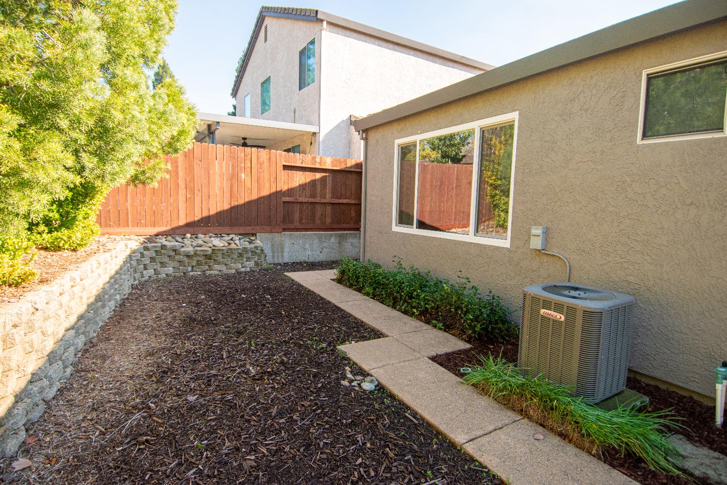 105 Whiting Way Folsom, CA 95630 - Photo 48 of 78 a view of a house with a small yard and a pathway