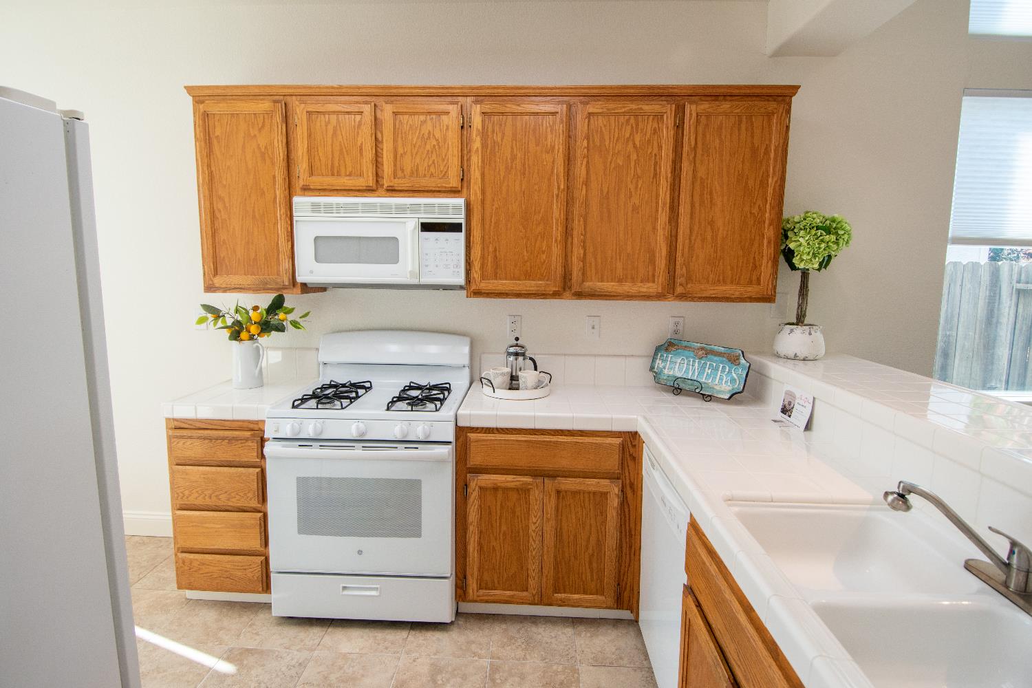 105 Whiting Way Folsom, CA 95630 - Photo 6 of 78 a kitchen with a sink stove and cabinets