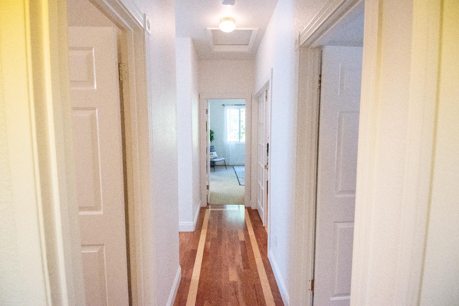 105 Whiting Way Folsom, CA 95630 - Photo 61 of 78 a view of a bedroom from a hallway