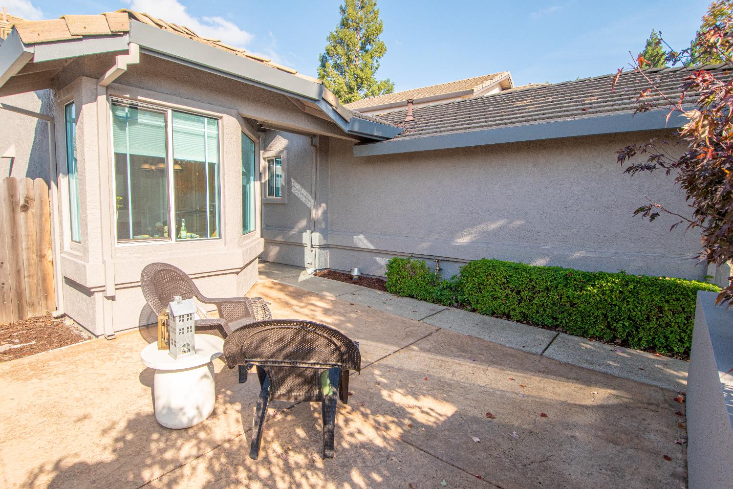 105 Whiting Way Folsom, CA 95630 - Photo 68 of 78 a view of a patio with table and chairs potted plants