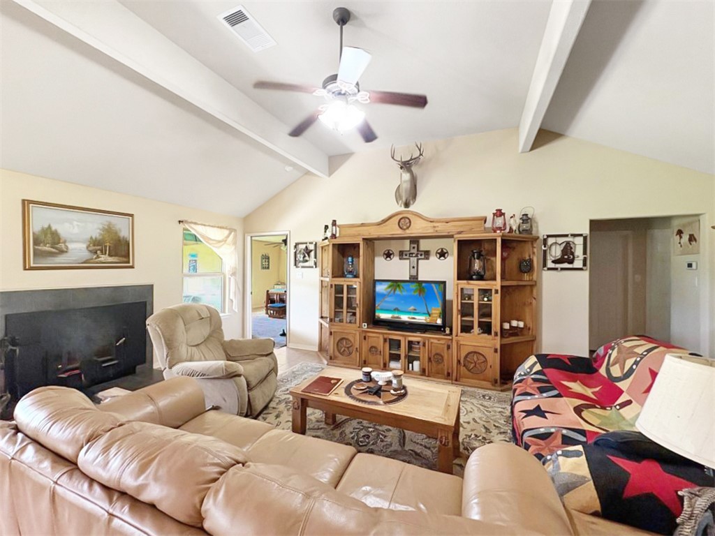1228 Cr 348 Loop Gause, TX 77857 - Photo 10 of 46 a living room with furniture ceiling fan and a rug