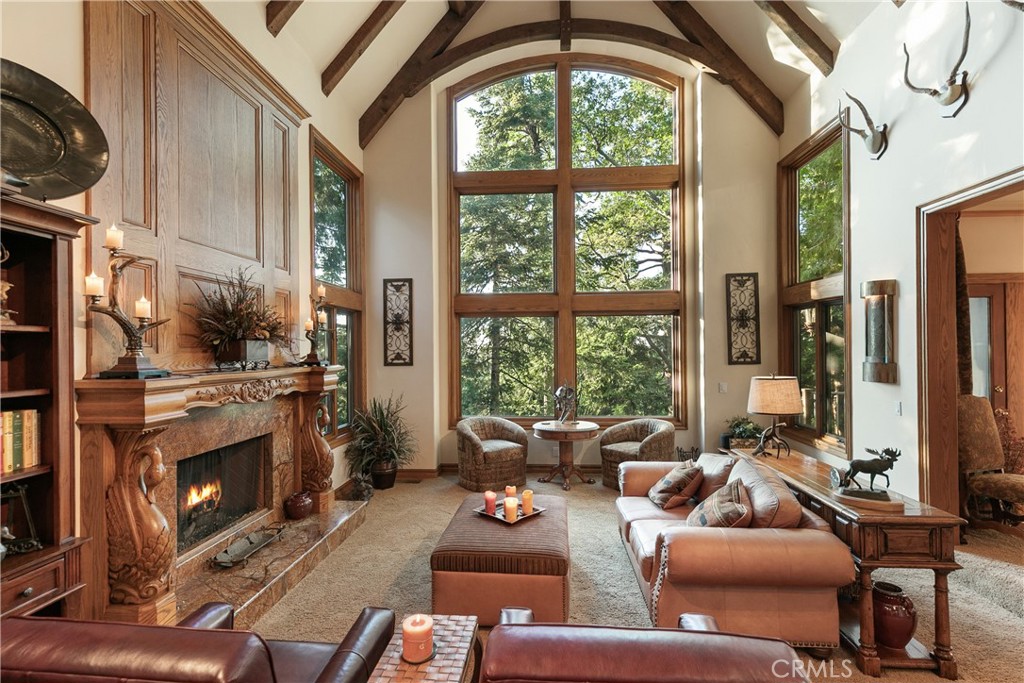 145 Pheasant Run Lake Arrowhead, CA 92352 - Photo 5 of 65 a living room with furniture fireplace and a large window