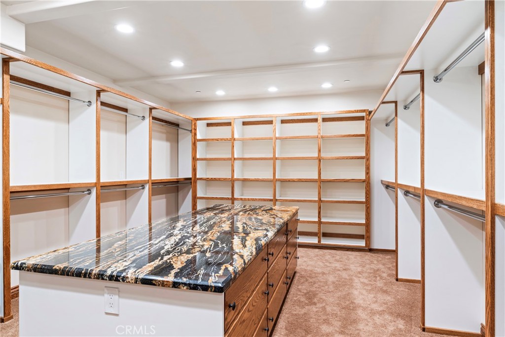 145 Pheasant Run Lake Arrowhead, CA 92352 - Photo 51 of 65 a view of walk in closet with empty racks