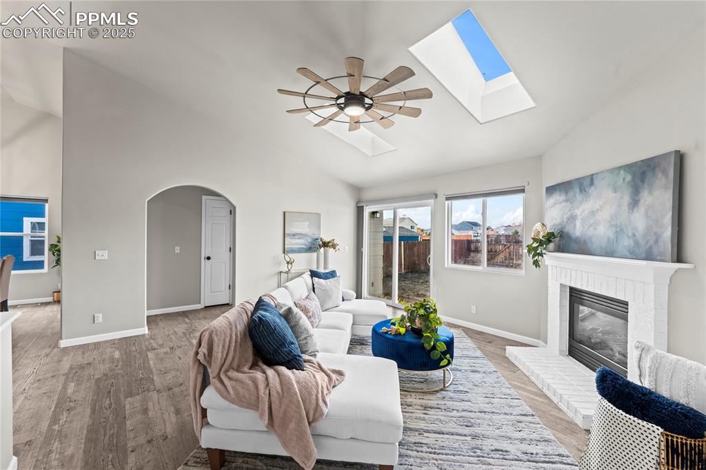 8168 Oliver Road Peyton, CO 80831 - Photo 16 of 42 a living room with furniture and a fireplace