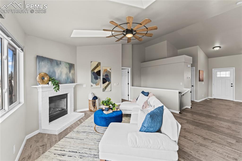 8168 Oliver Road Peyton, CO 80831 - Photo 17 of 42 a living room with furniture and a fireplace