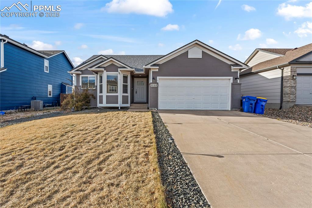8168 Oliver Road Peyton, CO 80831 - Photo 2 of 42 a front view of a house with a yard