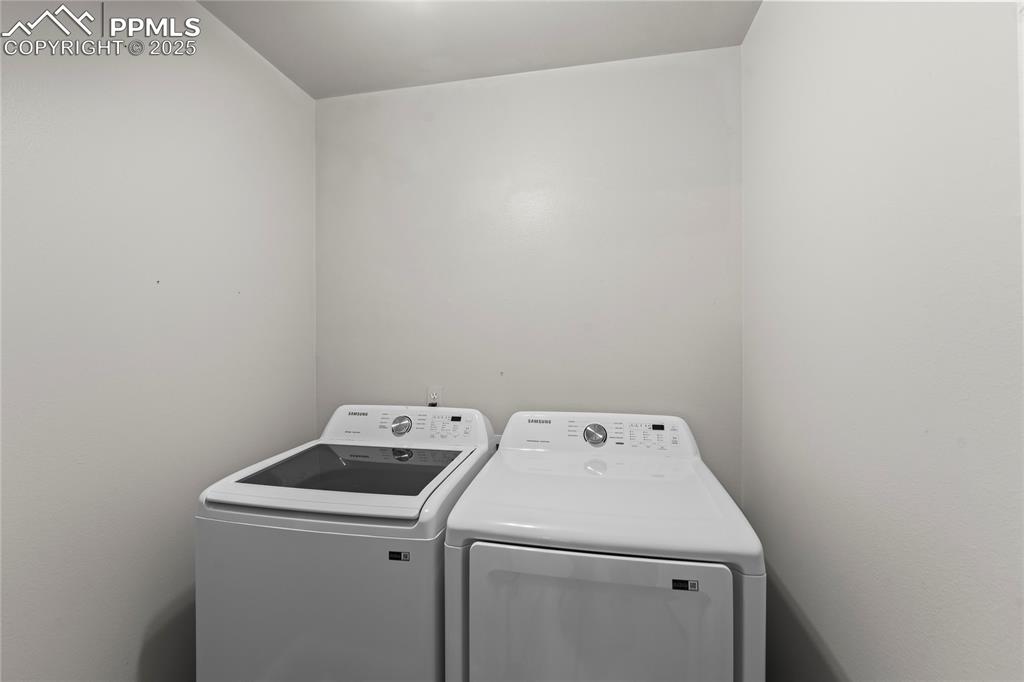 8168 Oliver Road Peyton, CO 80831 - Photo 24 of 42 a utility room with dryer and washer