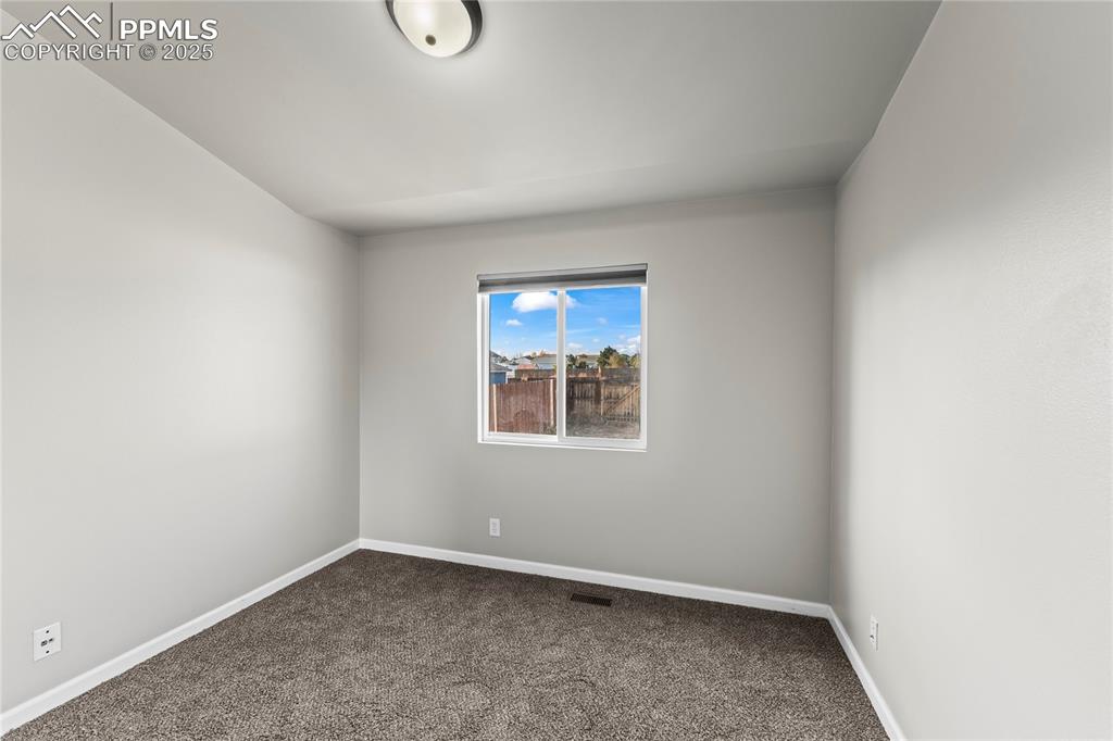 8168 Oliver Road Peyton, CO 80831 - Photo 26 of 42 an empty room with a window