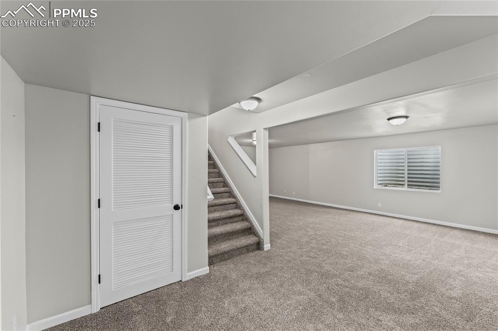 8168 Oliver Road Peyton, CO 80831 - Photo 29 of 42 a view of an empty room with stairs