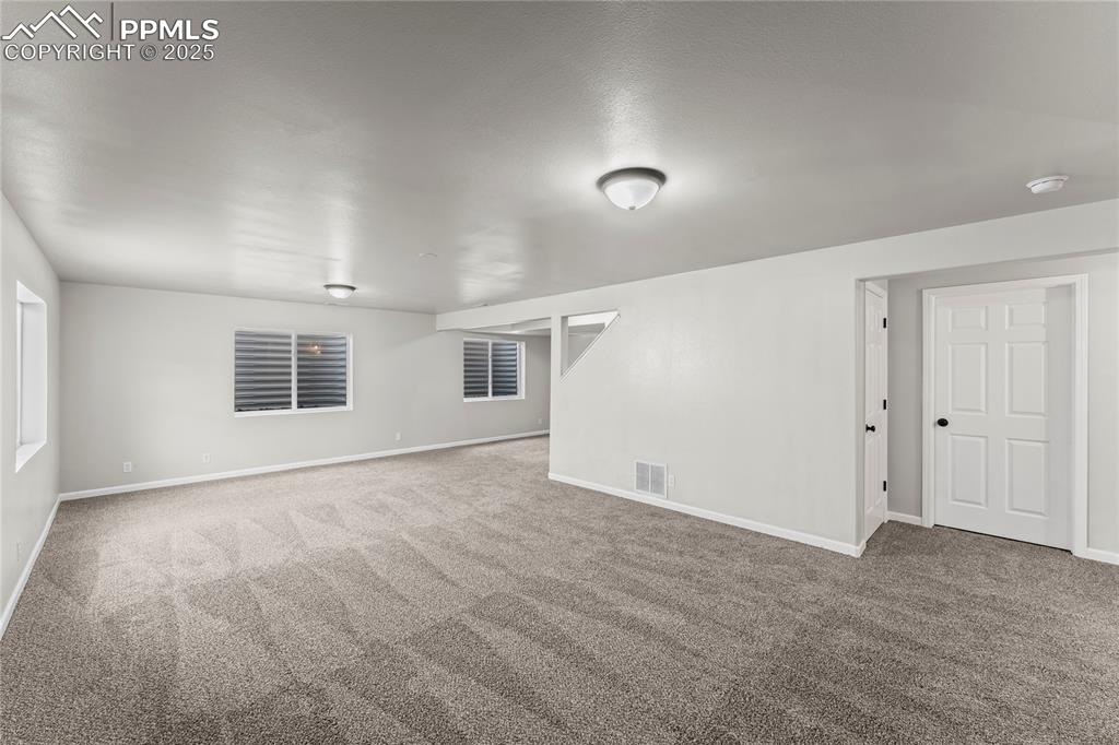 8168 Oliver Road Peyton, CO 80831 - Photo 31 of 42 an empty room with windows