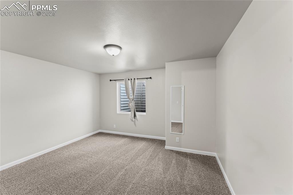 8168 Oliver Road Peyton, CO 80831 - Photo 33 of 42 an empty room with windows