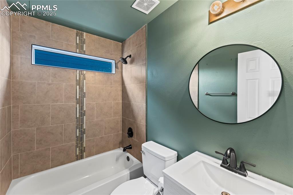 8168 Oliver Road Peyton, CO 80831 - Photo 35 of 42 a bathroom with a sink and a mirror