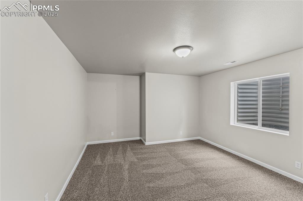 8168 Oliver Road Peyton, CO 80831 - Photo 37 of 42 a view of an empty room with a window