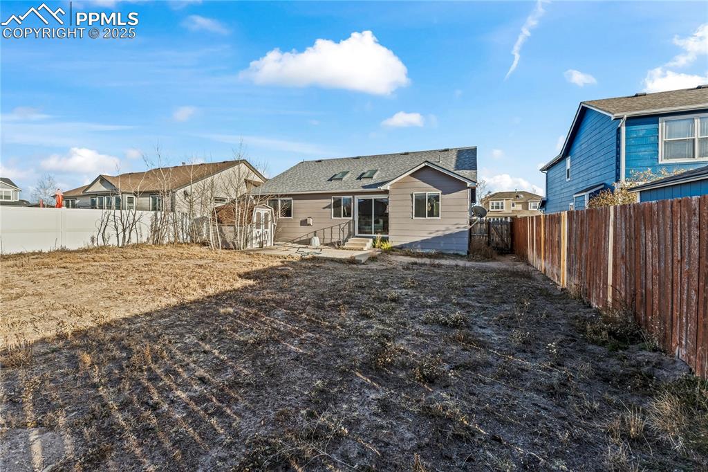 8168 Oliver Road Peyton, CO 80831 - Photo 38 of 42 a front view of a house with a yard