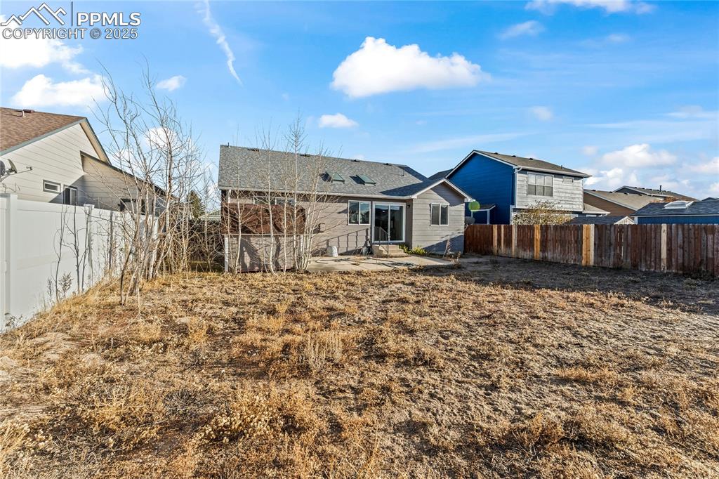 8168 Oliver Road Peyton, CO 80831 - Photo 39 of 42 a front view of a house with a yard