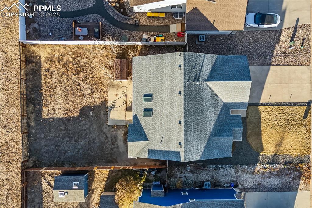 8168 Oliver Road Peyton, CO 80831 - Photo 41 of 42 an aerial view of a house with a yard and large tree