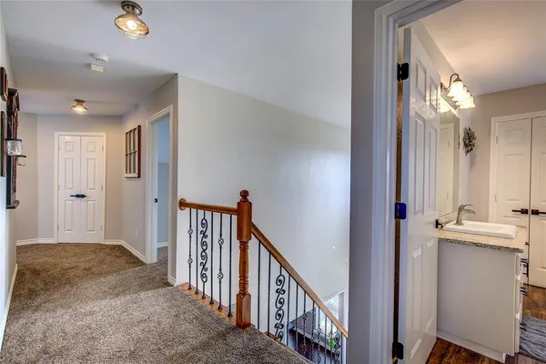 a view of a hallway view with staircase