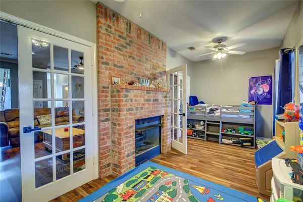 a living room with furniture fireplace and a flat screen tv