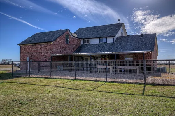 a view of house with a swimming pool