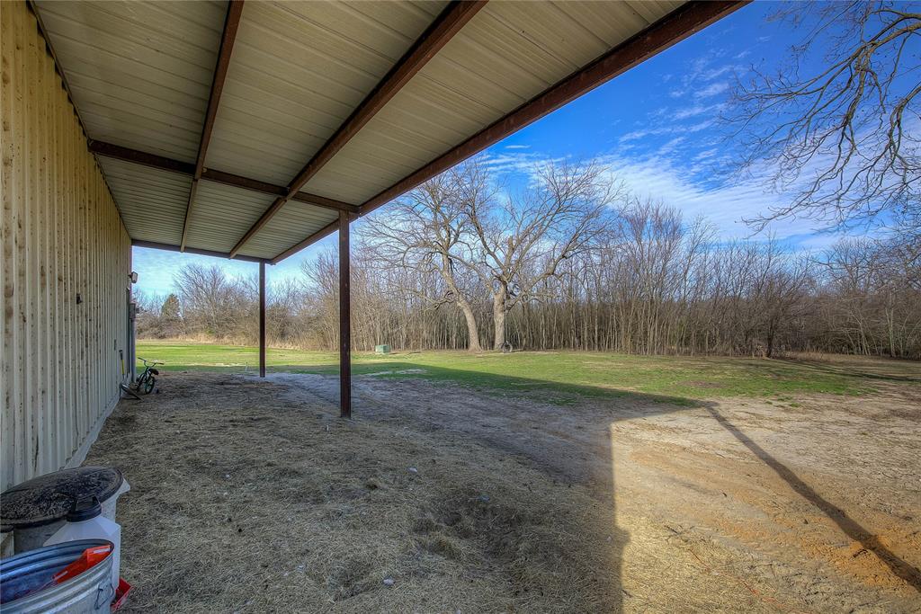 5611 County Road 4705 Commerce, TX 75428 - Photo 31 of 38 a view of a backyard with of trees