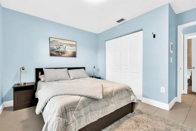 a bedroom with a bed and a view of bedroom