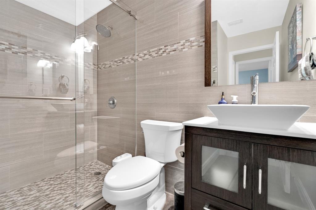 14809 Southwest 154th Court Miami, FL 33196 - Photo 22 of 30 a bathroom with a sink toilet and shower