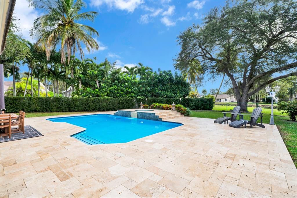 14809 Southwest 154th Court Miami, FL 33196 - Photo 26 of 30 a view of a swimming pool with a patio
