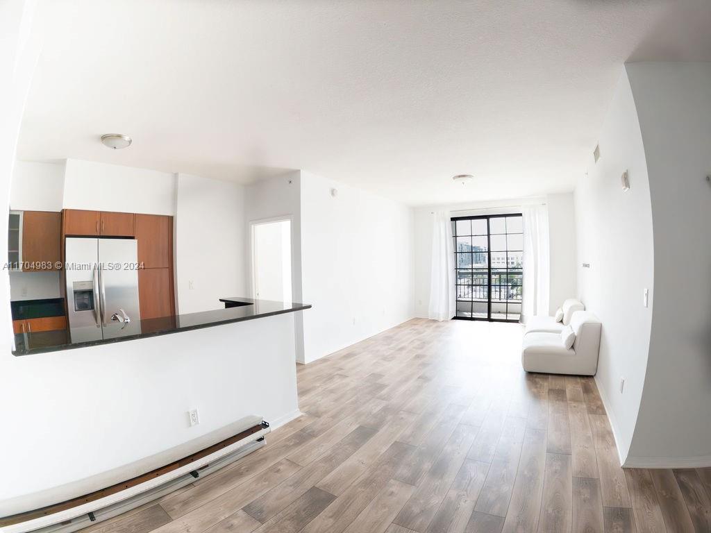 233 South Federal Highway, Unit 723 Boca Raton, FL 33432 - Photo 1 of 35 wooden floor in an empty room with a window