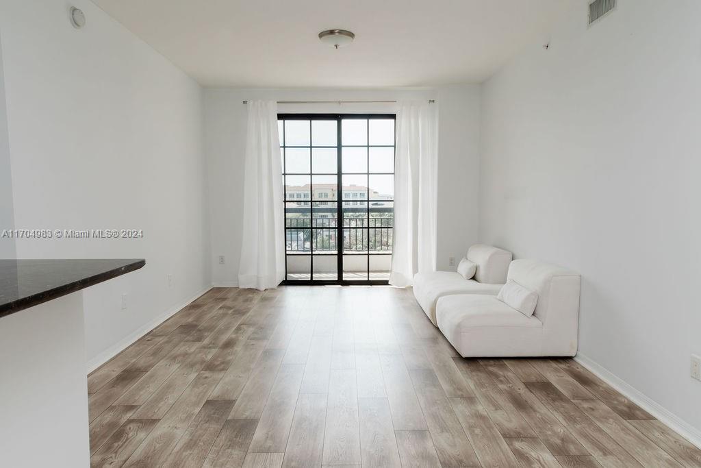 233 South Federal Highway, Unit 723 Boca Raton, FL 33432 - Photo 16 of 35 a living room with furniture and a large window