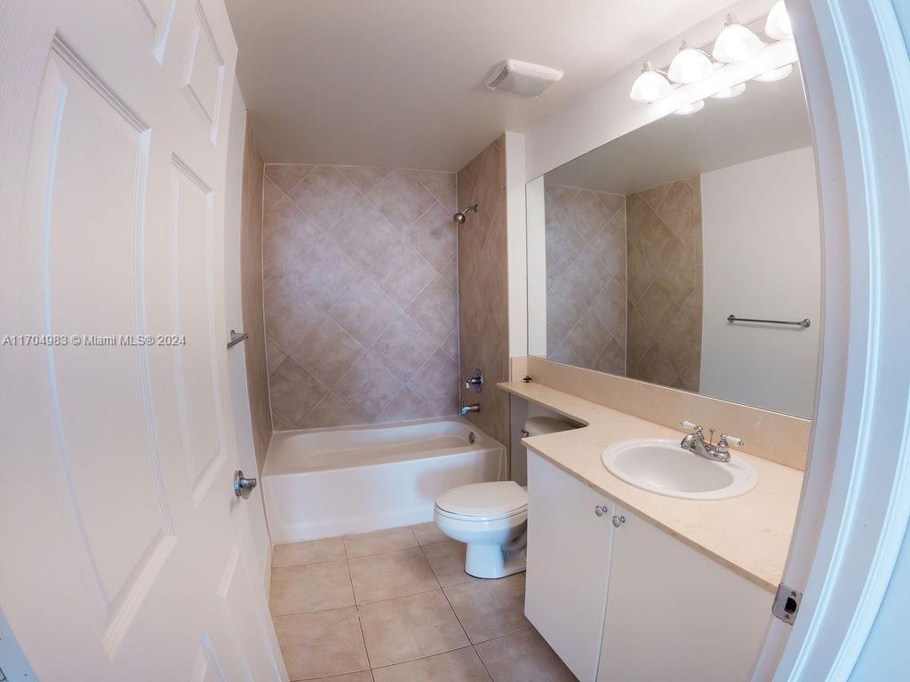 233 South Federal Highway, Unit 723 Boca Raton, FL 33432 - Photo 21 of 35 a bathroom with a sink a toilet and shower
